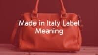 Elegant Italian leather handbag with 'Made in Italy' label, high-quality craftsmanship, luxurious materials, stylish design, realistic.